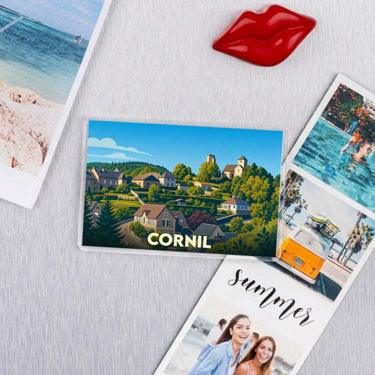 Magnet souvenir de la ville de Cornil avec une illustration stylisée de ses paysages et habitations.