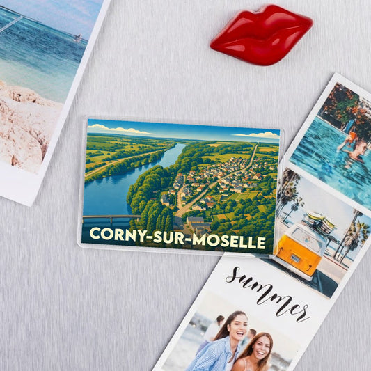 Magnat souvenir de la ville de Corny-sur-Moselle avec une illustration paysagère stylisée.