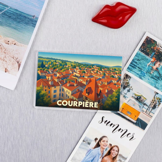 Magnet souvenir de la ville de Courpière avec une illustration stylisée.