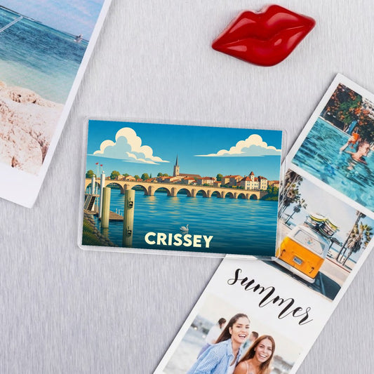 Magnet souvenir de la ville de Crissey avec une illustration stylisée d'un pont traversant une rivière.