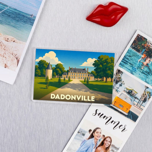 Magnet souvenir de la ville de Dadonville avec une illustration stylisée d'un château.