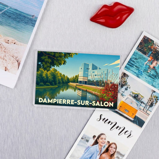 Magnet souvenir de la ville de Dampierre-sur-Salon avec une illustration stylisée d'un bâtiment moderne au bord de l'eau.