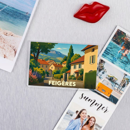 Magnet souvenir de la ville de Feigères avec une illustration stylisée.