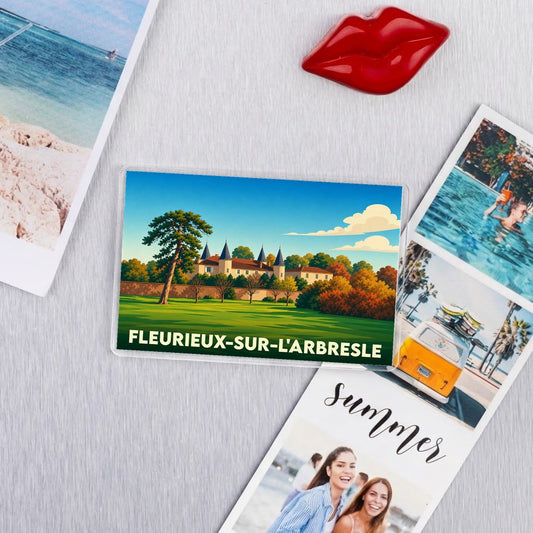 Magnet rectangulaire souvenir de la ville de Fleurieux-sur-l'Arbresle avec une illustration stylisée d'un château.