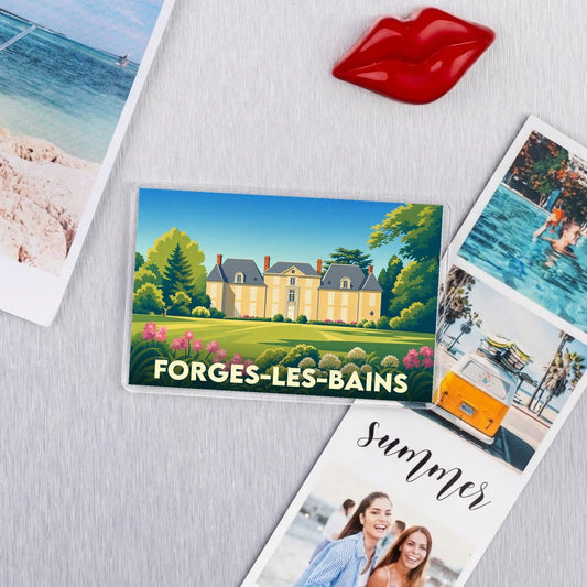 Magnet souvenir de la ville de Forges-les-Bains avec une illustration stylisée d'un château entouré d'un parc verdoyant.