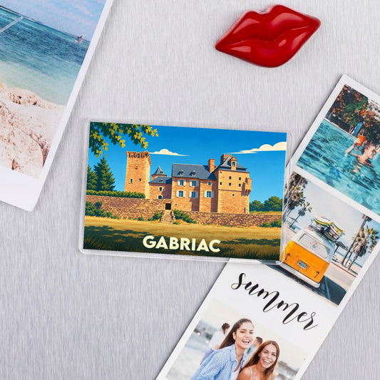 Magnet souvenir de la ville de Gabriac avec une illustration stylisée de son château.