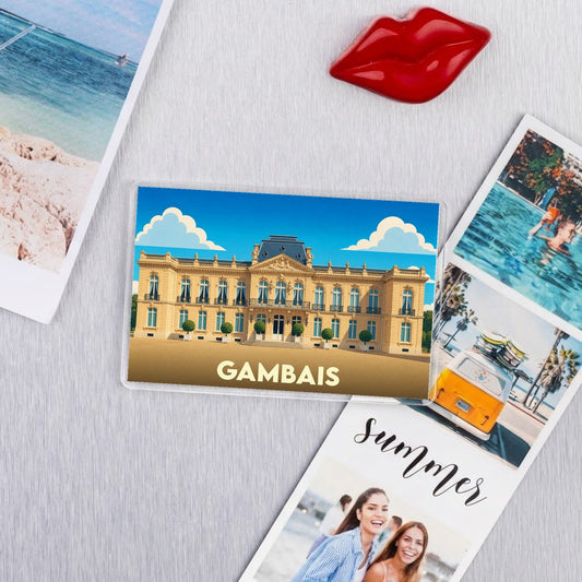 Magnet souvenir de la ville de Gambais avec une illustration stylisée d'un château.