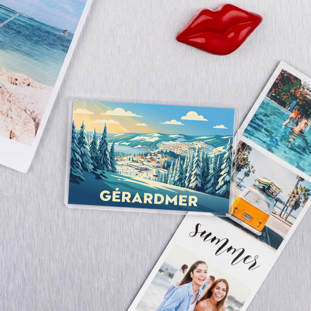 Magnet souvenir de la ville de Gérardmer avec une illustration stylisée d'un paysage de montagne enneigé.