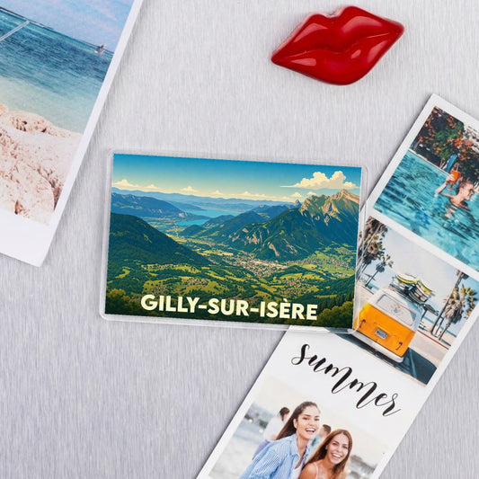 Magnet souvenir de la ville de Gilly-sur-Isère avec une illustration panoramique de montagnes et de vallée.