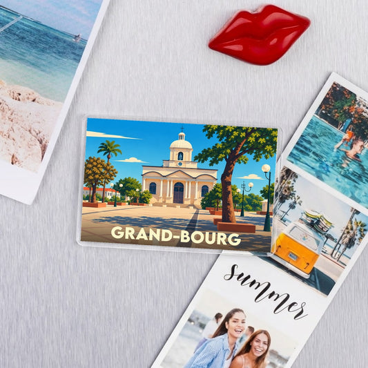 Magnet souvenir de la ville de Grand-Bourg avec une illustration stylisée de son église et de sa place.