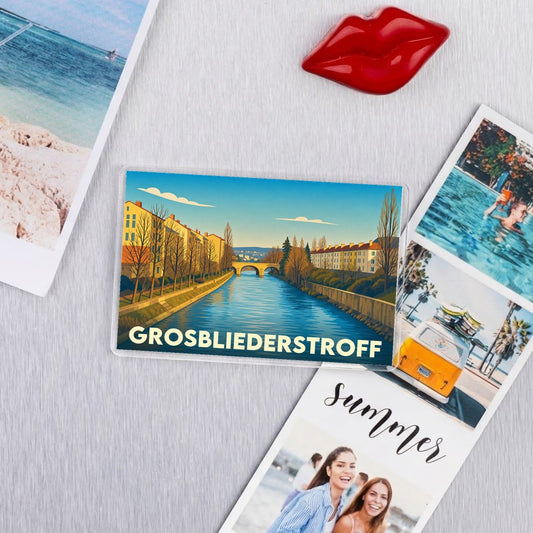 Magnet souvenir de la ville de Grosbliederstroff avec une illustration stylisée d'un canal et de son pont.