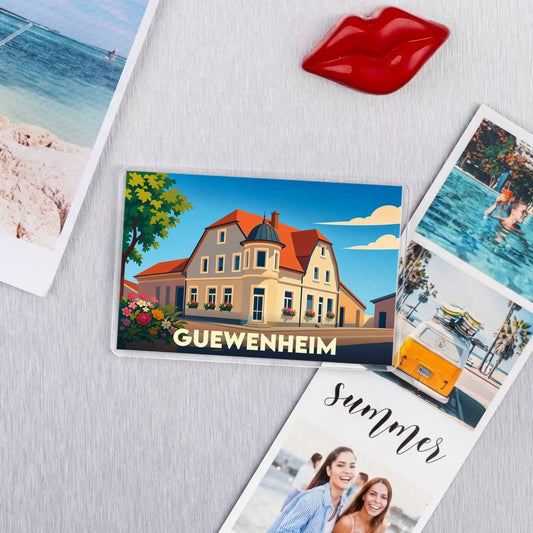 Magnet souvenir de la ville de Guewenheim avec une illustration stylisée.