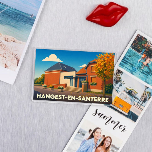Magnet souvenir de la ville de Hangest-en-Santerre avec une illustration stylisée d'une maison.