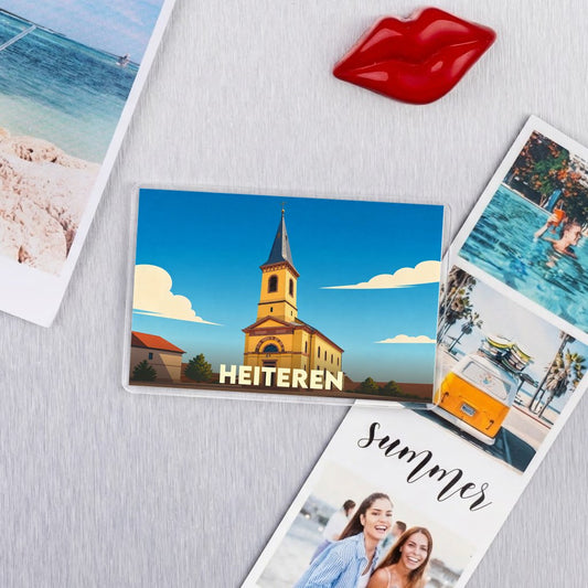Magnet souvenir de la ville de Heiteren avec une illustration stylisée de son église.