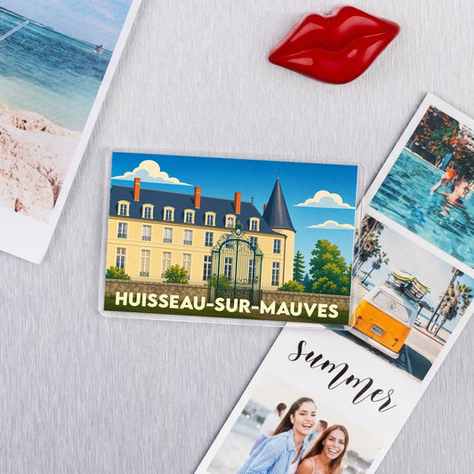 Magnet souvenir de la ville de Huisseau-sur-Mauves avec une illustration stylisée du château local.