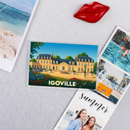 Magnet souvenir de la ville de Igoville représentant une illustration stylisée d'un château.