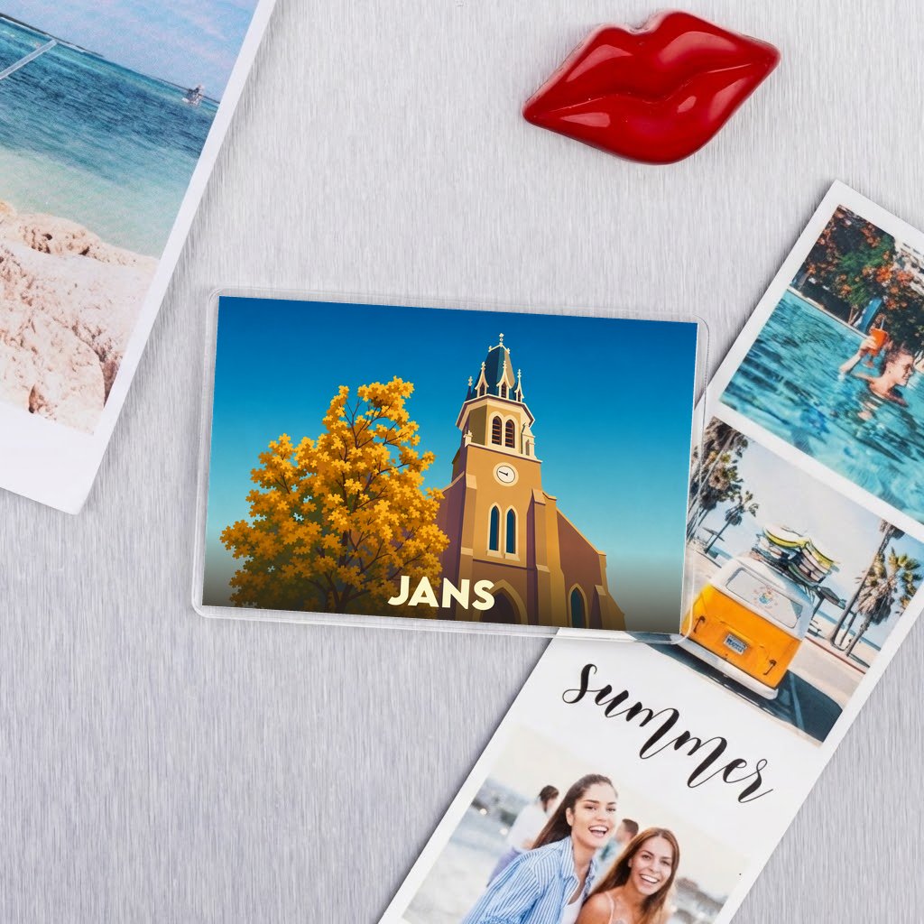 Magnet souvenir de la ville de Jans avec une illustration stylisée d'une église et d'un arbre automnal.