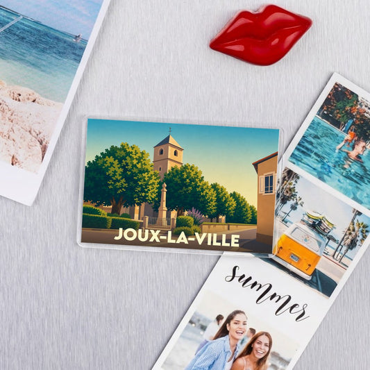 Magnet souvenir de la ville de Joux-la-Ville avec une illustration stylisée.