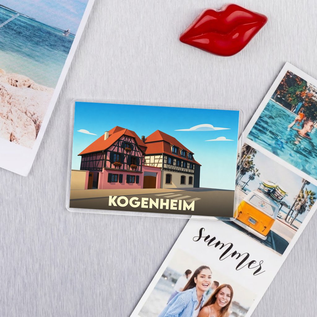 Magnet souvenir de la ville de Kogenheim avec une illustration stylisée de maisons à colombages.
