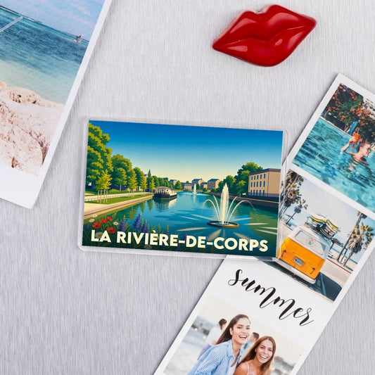 Magnet souvenir de la ville de La Rivière-de-Corps avec une illustration stylisée de ses bords de l'eau.