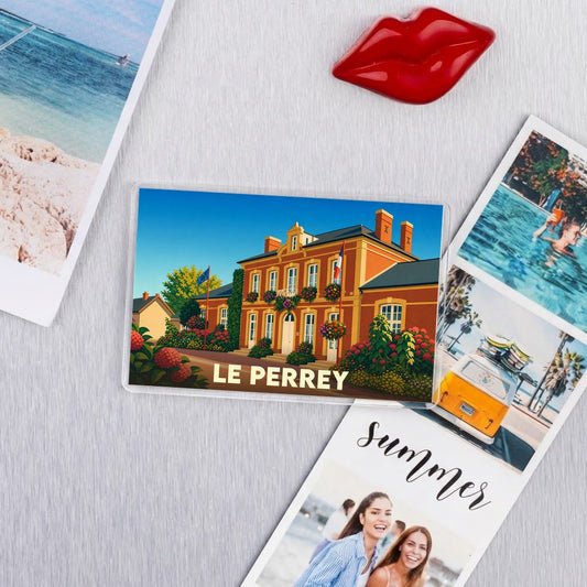 Magnet souvenir de la ville de Le Perrey avec une illustration stylisée.