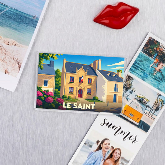 Magnet souvenir de la ville de Le Saint avec une illustration stylisée.