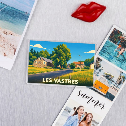 Magnet souvenir de la commune de Les Vastres avec une illustration de paysage rural.