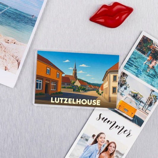 Magnet souvenir de la ville de Lutzelhouse avec une illustration stylisée.
