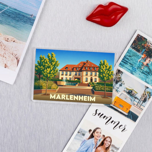 Magnet souvenir de la ville de Marlenheim avec une illustration colorée de l'architecture locale.