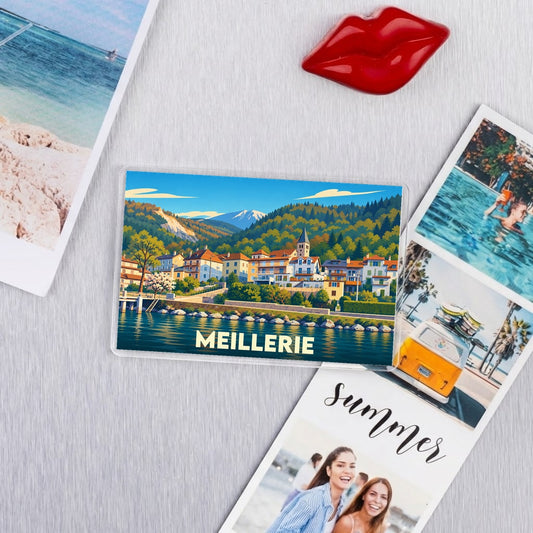 Magnet souvenir de la ville de Meillerie avec une illustration colorée et stylisée du bord de lac.