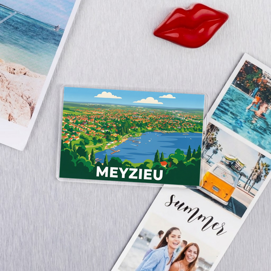 Magnet souvenir de la ville de Meyzieu avec une illustration stylisée.