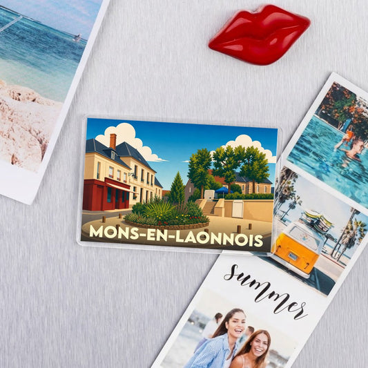 Magnet souvenir de la ville de Mons-en-Laonnois avec une illustration stylisée.