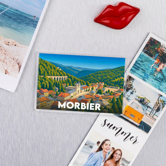 Magnet souvenir de la ville de Morbier avec une illustration stylisée.