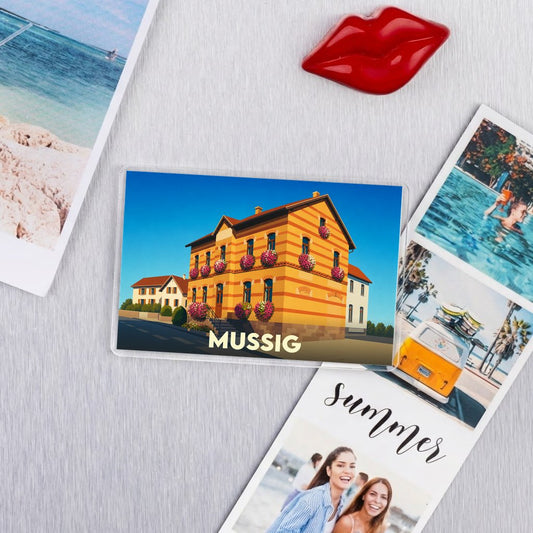 Magnet souvenir de la ville de Mussig avec une illustration stylisée.