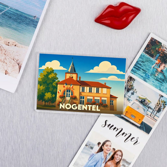 Magnet souvenir de la ville de Nogentel avec une illustration stylisée.