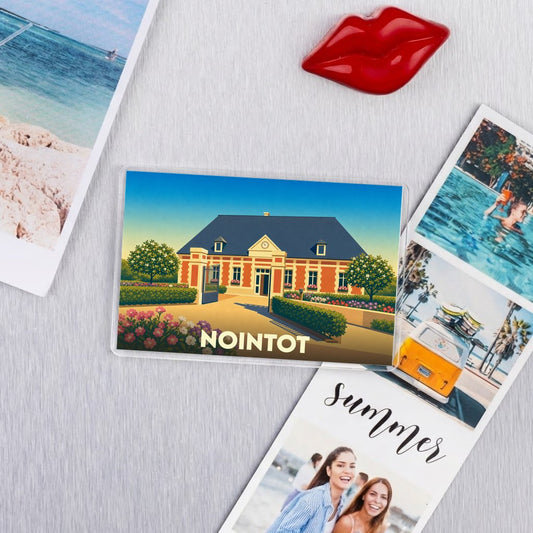 Magnet souvenir de la ville de Nointot avec une illustration stylisée d'un bâtiment historique.
