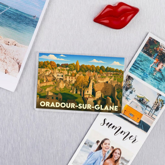 Magnet souvenir de la ville d'Oradour-sur-Glane avec une illustration stylisée des ruines du village.