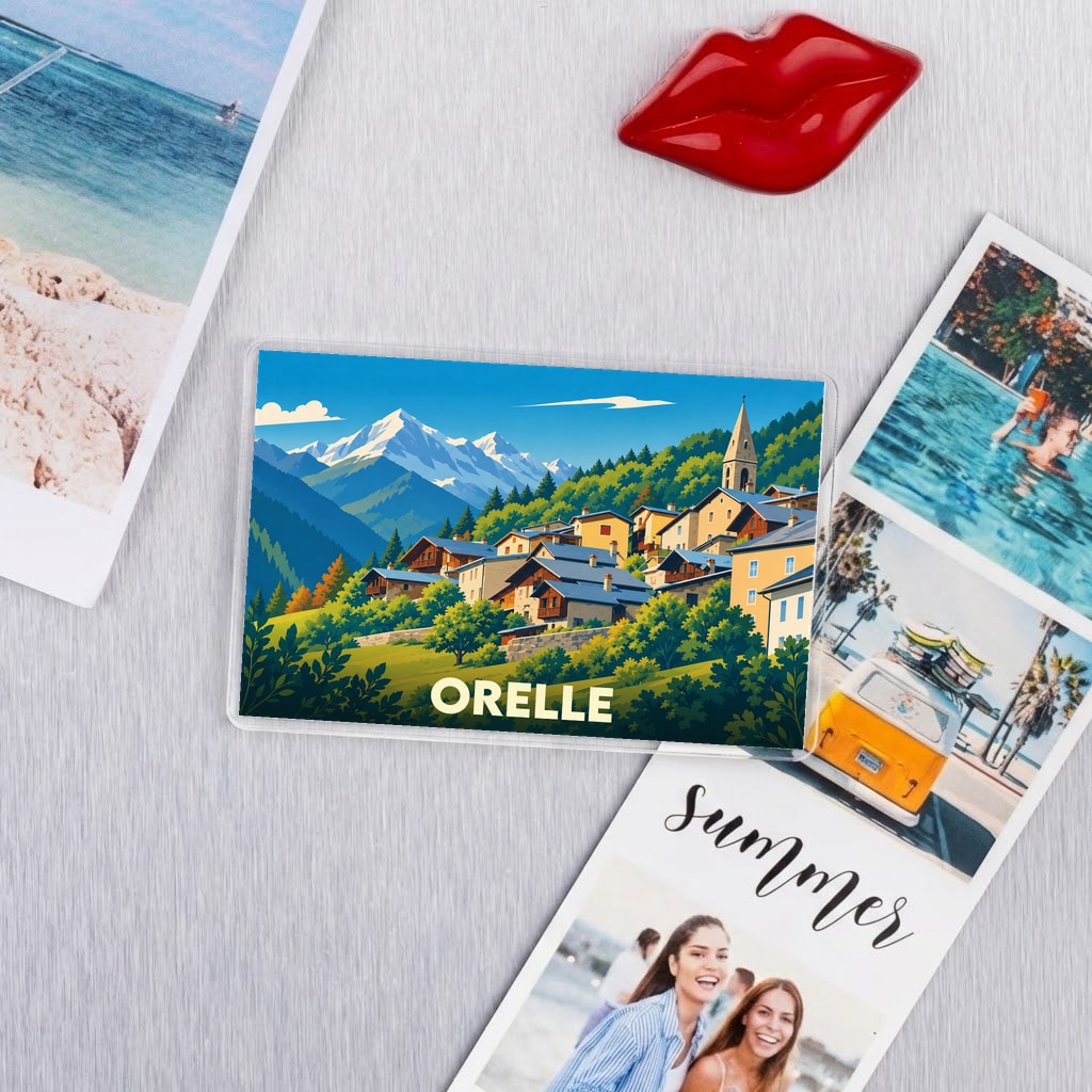 Magnet souvenir de la ville d'Orelle avec une illustration stylisée de montagne.
