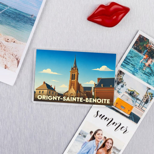 Magnet souvenir de la ville d'Origny-Sainte-Benoite avec une illustration stylisée de son église.
