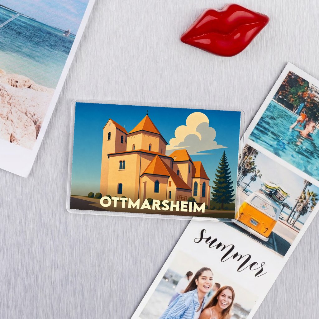 Magnet souvenir de la ville d'Ottmarsheim avec une illustration stylisée de son église abbatiale.