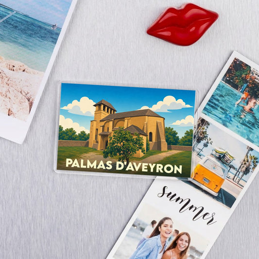 Magnet souvenir de la ville de Palmas d'Aveyron avec une illustration stylisée de son église.