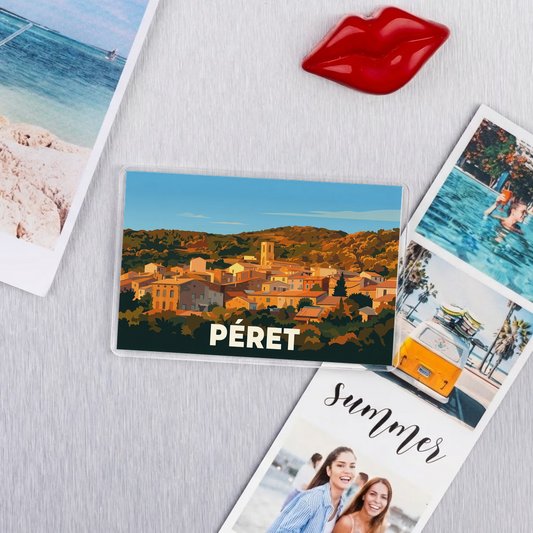 Magnet souvenir de la ville de Péret avec une illustration stylisée.