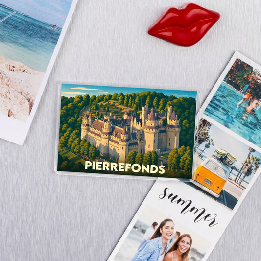 Magnet souvenir de la ville de Pierrefonds avec une illustration stylisée du château entouré d'une forêt.
