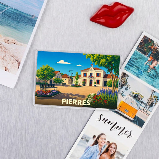 Magnet souvenir de la ville de Pierres avec une illustration stylisée d'une place de village.