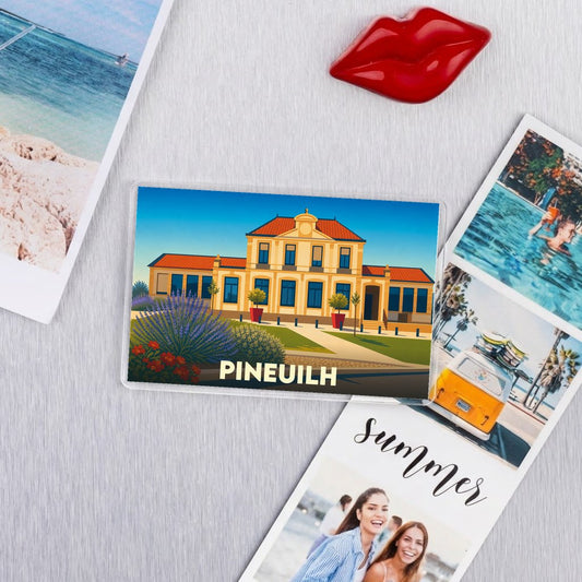 Magnet souvenir de la ville de Pineuilh avec une illustration stylisée.