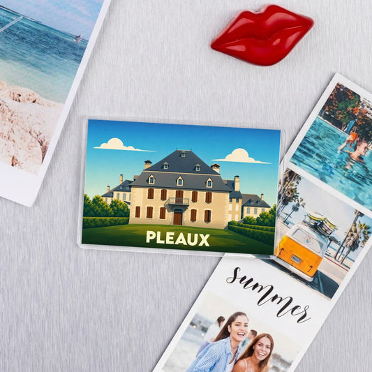 Magnet souvenir de la ville de Pleaux avec une illustration stylisée d'un château.