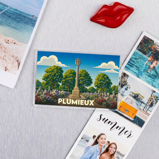 Magnet souvenir de la ville de Plumieux avec une illustration stylisée d'un calvaire breton.