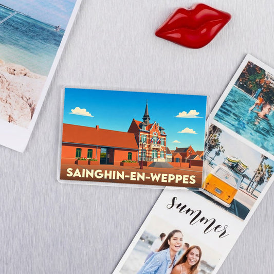 Magnet souvenir de la ville de Sainghin-en-Weppes avec une illustration stylisée de son hôtel de ville.