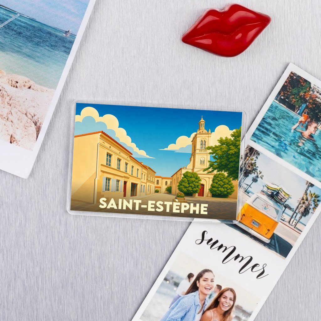 Magnet souvenir de la ville de Saint-Estèphe avec une illustration stylisée d'une rue et de son église.