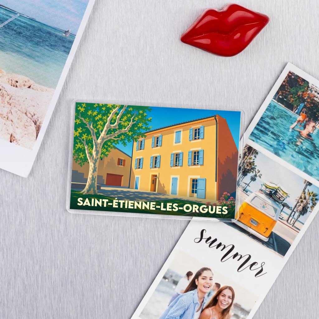 Magnet souvenir de la ville de Saint-Étienne-les-Orgues avec une illustration stylisée d'un bâtiment provençal.